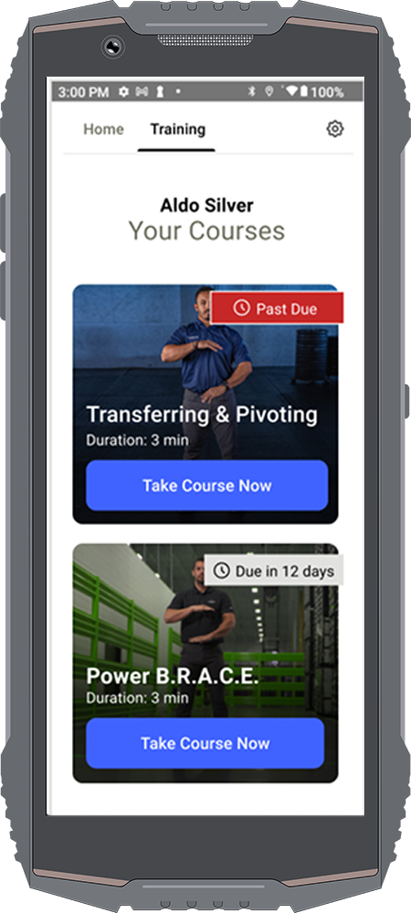 A rugged handheld device displaying a training dashboard screen for a user named Aldo Silver. The screen shows two training courses: 'Transferring & Pivoting,' marked as 'Past Due,' and 'Power B.R.A.C.E.,' due in 12 days. Each course has a duration of 3 minutes and features a 'Take Course Now' button. The interface is clean and structured, with a navigation bar at the top labeled 'Home' and 'Training.'